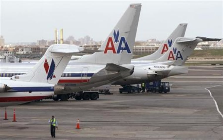 American Airlines aircraft sit on the tarmac at LaGuardia airport following a reservation system outage in New York