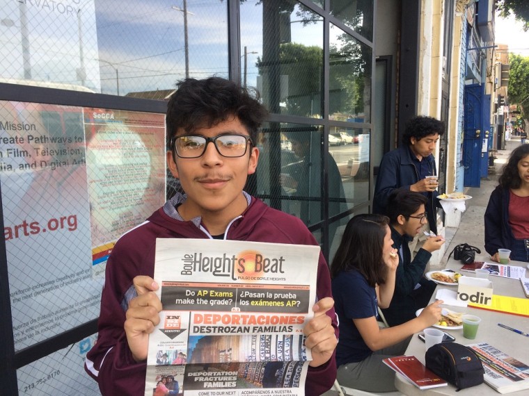 Boyle Heights Beat youth reporter Alex Medina with the latest print edition of Boyle Heights Beat.