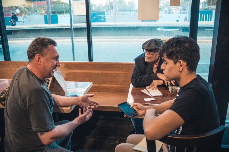 Youth reporter Josh Solis and senior editor Antonio Mejias-Rentas interview Tad Yenawine about his restaurant 'Purgatory Pizza'.