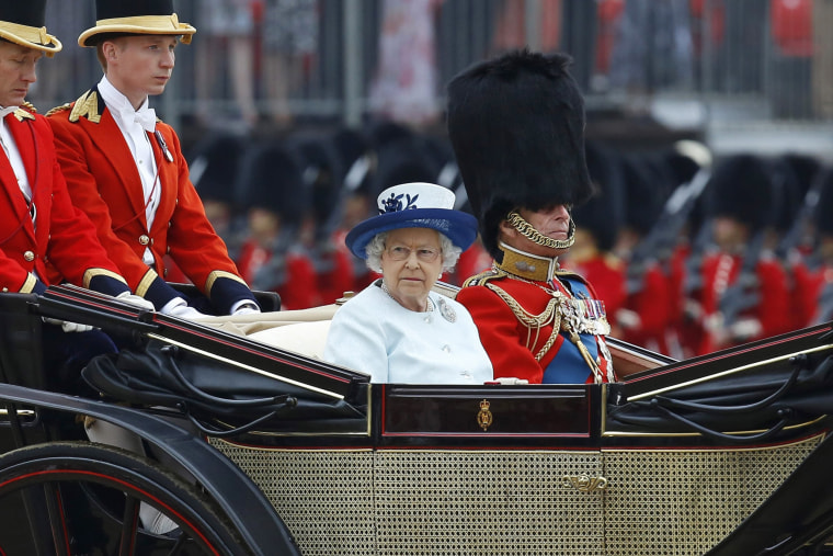 Image: Britain's Queen Elizabeth and Prince Philip leave the annual Trooping the Colour ceremony at Horse Guards Parade in central London