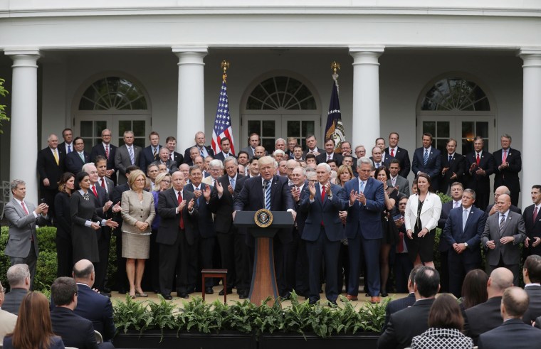 Image: Trump gathers with Republican House members after healthcare bill vote at the White House in Washington