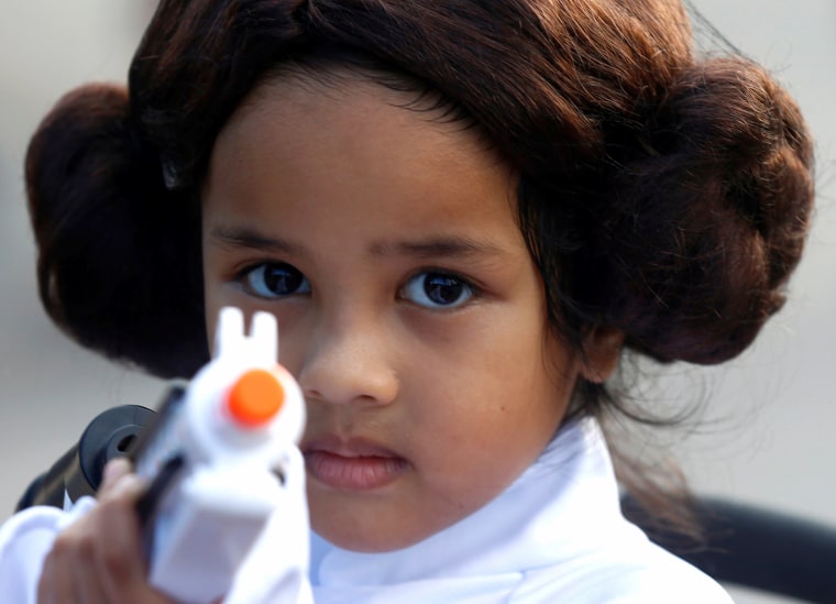 Image: Leia Farid, 4, poses for photos during activities to mark "May the 4th" Star Wars Day at Gardens by the Bay in Singapore