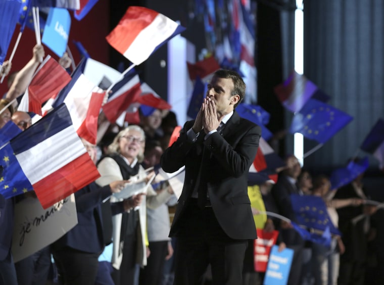 Image: French independent centrist presidential candidate Emmanuel Macron greets his supporters prior to his address during an election campaign rally