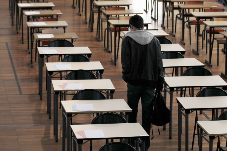 Image: A student arrives to take the philosophy baccalaureate exam at the French Clemenceau Lycee in Nantes