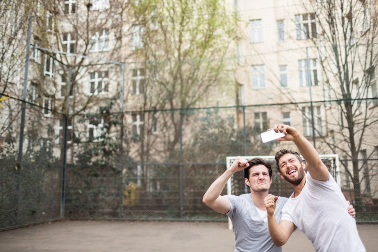 Friends Taking Selfie At Urban Soccer Ground
