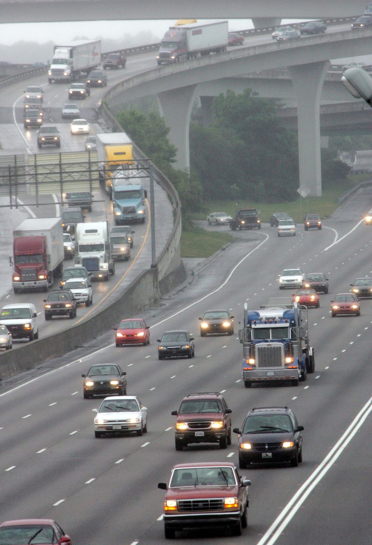 Image: Traffic moves through the I-85/I-285 interchange, known locally as "Spaghetti Junction" in Atlanta on June 1, 2005.