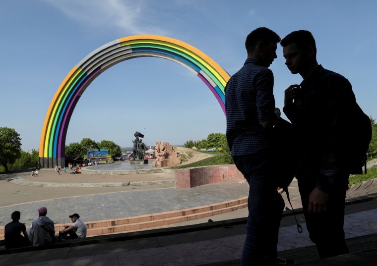 Image: Soviet "Arch of the Friendship of Nations" painted with rainbow colours is seen in central Kiev