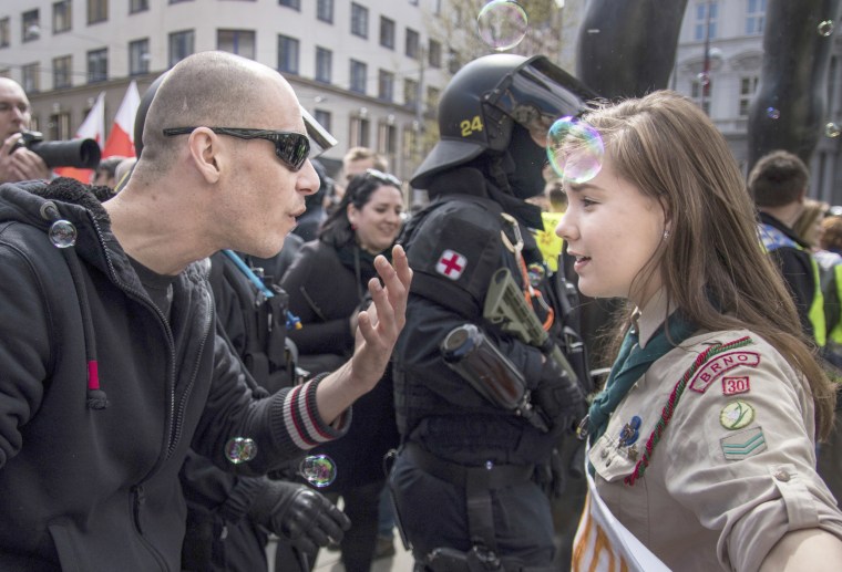 Image: In this picture taken in Brno, Czech Republic, May 1, 2017, 16-year-old Lucie Myslikova talks to a protester at a right wing demonstration.