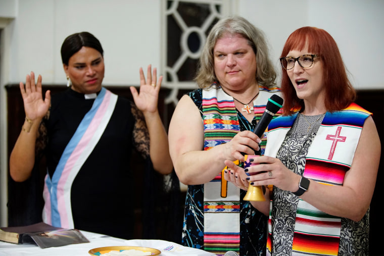 Image: Trans pastors Cindy Bourgeois from Canada (C) and Alexya Salvador from Brazil listen to trans Baptist reverend Allyson Robinson from the U.S. during a mass in Matanza