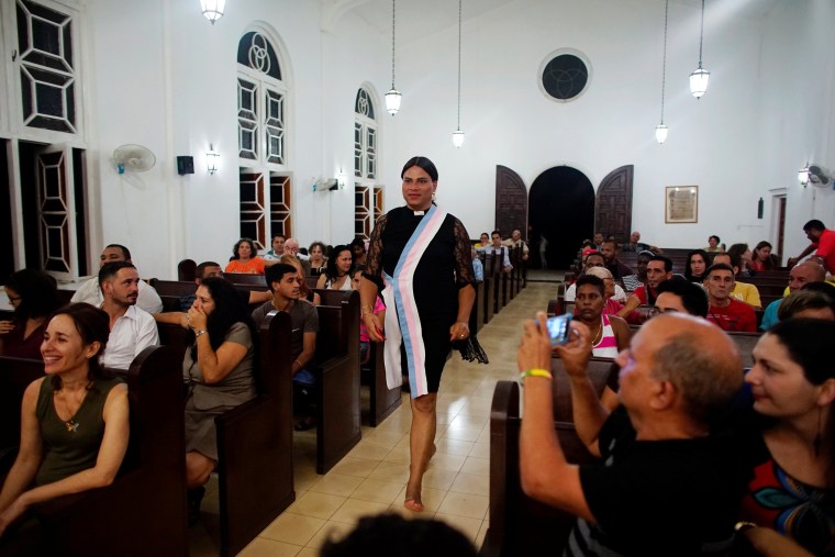Image: Alexya Salvador (C), a Brazilian trans pastor, walks during a mass in a church in Matanzas