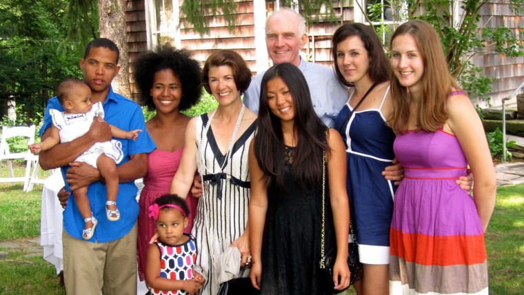 Amy Dickinson is pictured with her husband, Bruno Schickel, and their blended family. 