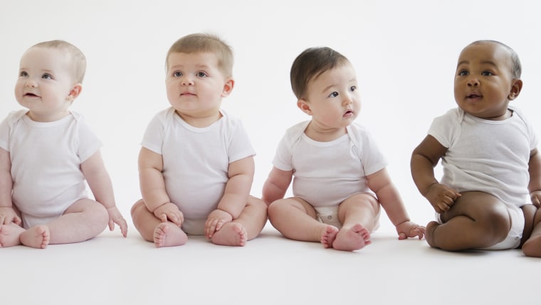 Babies sitting on floor together