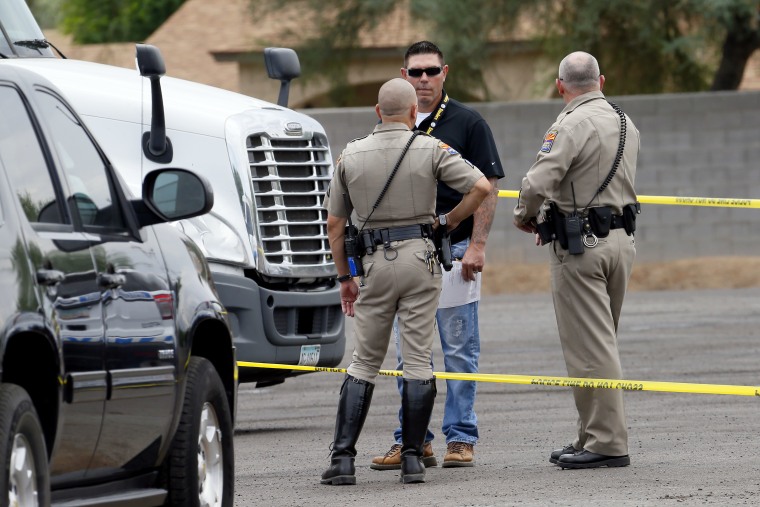 Arizona Department of Public Safety officers investigate one of the I-10 shootings in September 2015.