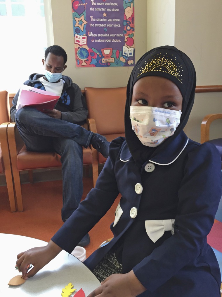 Image:  Amira Hassan,of Burnsville, Minn., plays in the waiting room at the specialty clinic at Children's Minnesota in Minneapolis