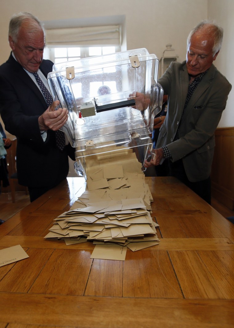 Image: A ballot box is emptied in Saint-Jean-de-Luz, France