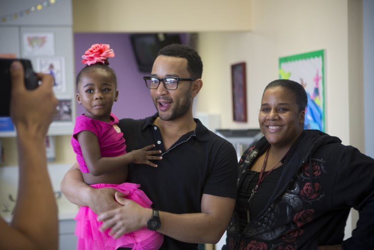 John Legend visiting the Sickle Cell Pediatrics unit at the Children's Hospital Los Angeles with AllOneBlood. He spent time and spoke with the kids who were getting treatment, surprising them with a performance in between rounds of treatment and therapy.