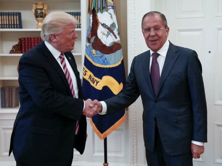 Image: Donald Trump shakes hands with Russia's Foreign Minister Sergei Lavrov