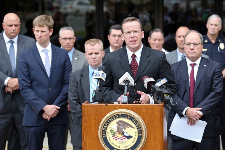 Image: FBI special agent Adam Lee speaks during a press conference