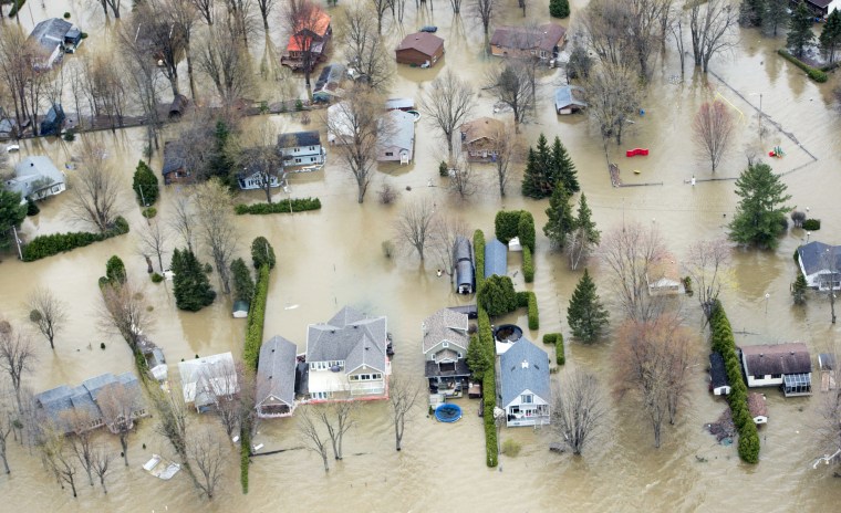 Image: An aerial photo shows flooded homes in Rigaud, Quebec