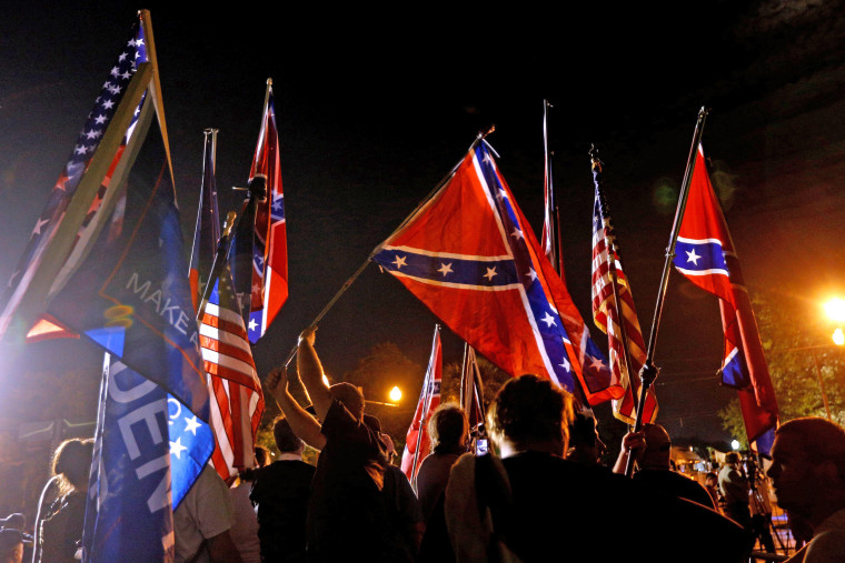 Image: Protesters gather before a monument of Jefferson Davis is removed in New Orleans