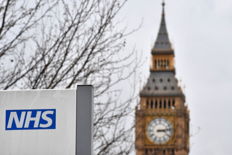 Image: A NHS sign is displayed outside a hospital in central London