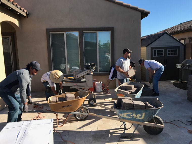 Craftsmen, neighbors spruce up family's property while they tend to son with cancerous brain tumor