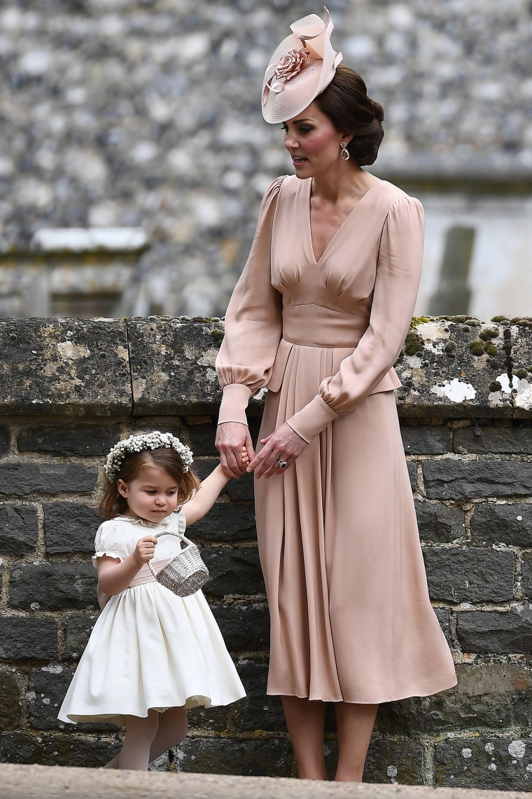 Princess Charlotte holds mom Duchess of Cambridge's hand