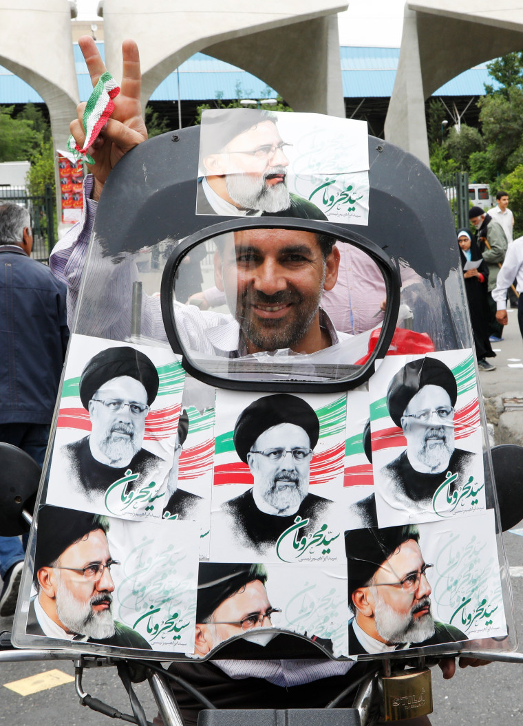 Image: A supporter of Ebrahim Rasi on a motorcycle