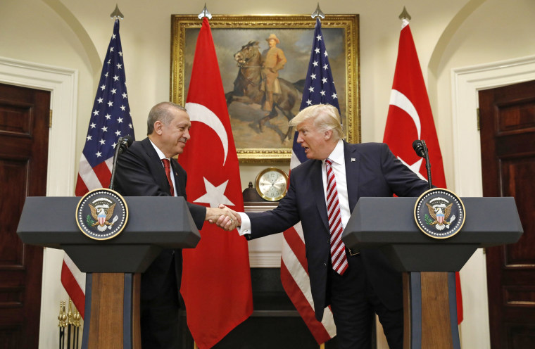 Image: Turkey's President Erdogan shakes hands with U.S. President Trump in the Roosevelt Room of the White House in Washington