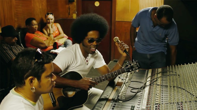Alex Cuba at mixing board