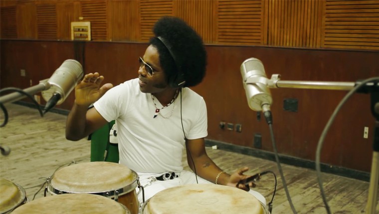 Alex Cuba recording with congas