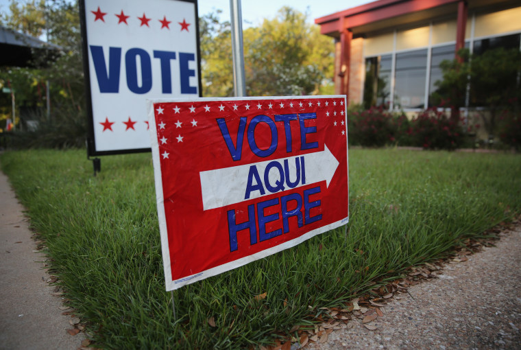 English-Spanish Signs Front Election Center In Texas