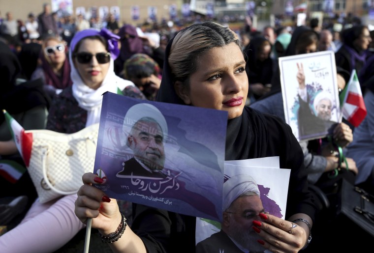Image: A supporter of Iran's President Hassan Rouhani