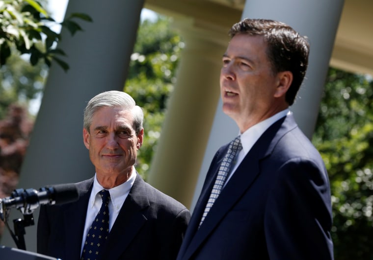 Image: James Comey speaks alongside outgoing FBI Director Robert Mueller at the White House in Washington