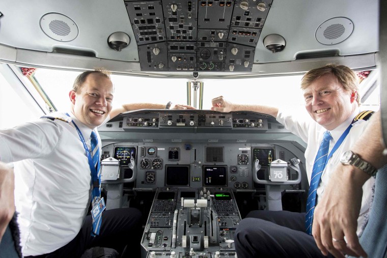 Image: Dutch King Willem-Alexander (R) inside the cockpit of a Fokker 70 with captain Maarten Putman (L).