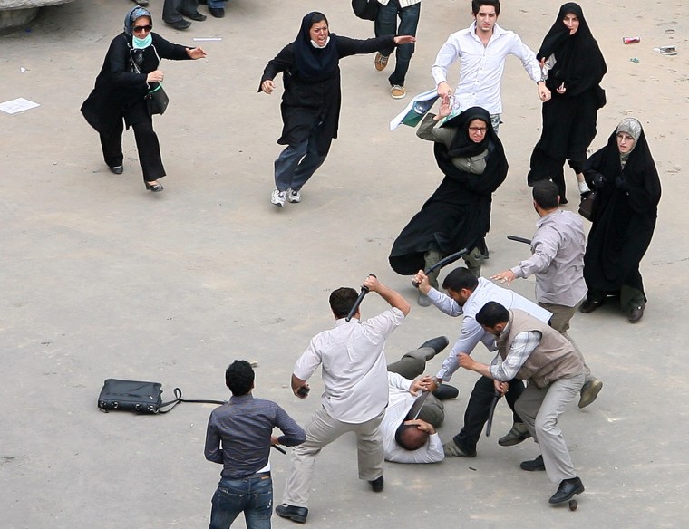 Image: An Iranian supporter of defeated Iranian presidential candidate Mir Hossein Mousavi is beaten by government security forces