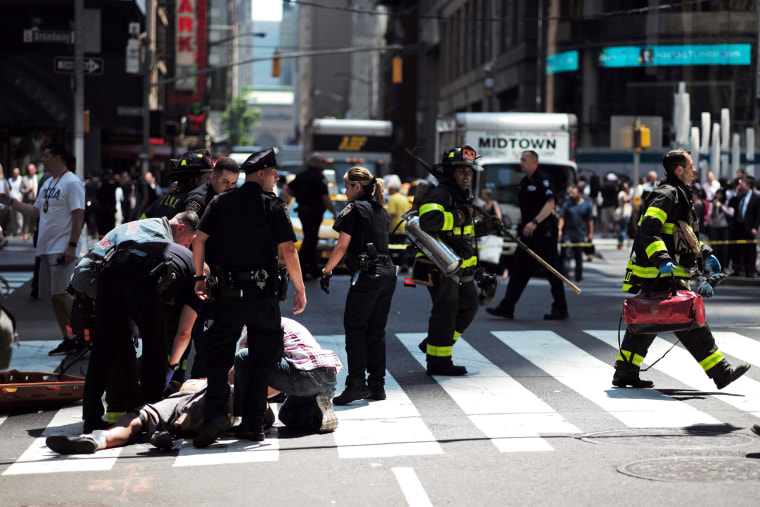 Image: First responders arrive at the scene after a car plunged into pedestrians in Times Square