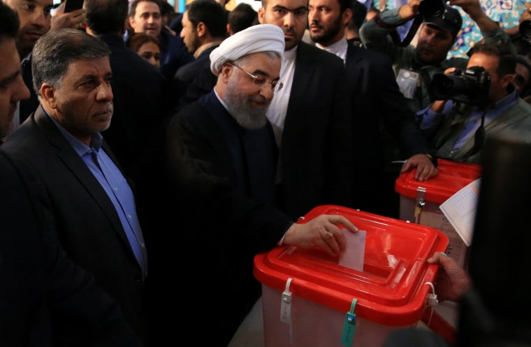 Image: Iranian President Hassan Rouhani casts his vote
