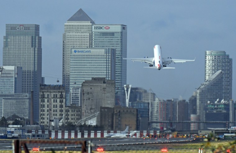 Image: A British Airways plane takes off at London City Airport