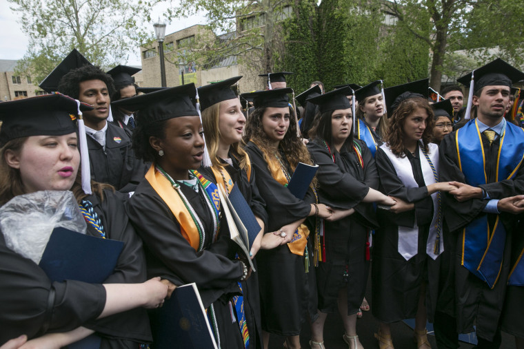 Image: Notre Dame students walk out of the commencement ceremony