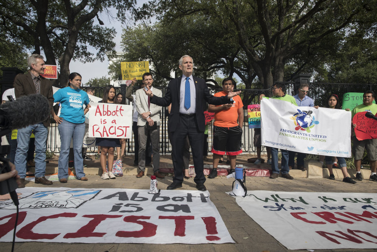 Image: Doggett speaks during a protest outside of the Texas Governor's Mansion in Austin