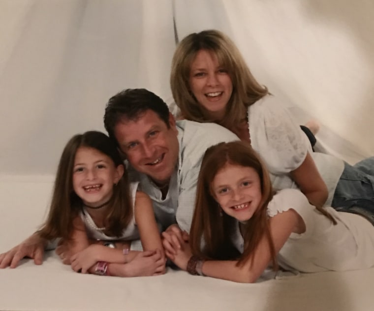 Stacy Feintuch is pictured with her family before the death of her husband in 2011.