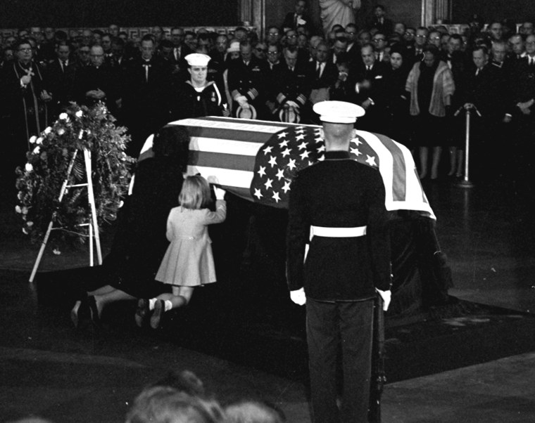 Jacqueline Kennedy kisses the casket of her husband, President John F. Kennedy, lying in state in the rotunda of the U.S. Capitol on Nov. 24, 1963.
