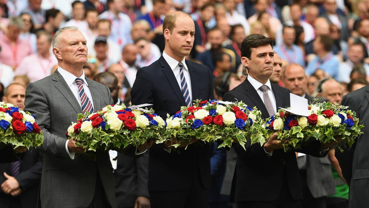 A hush fell over Wembley Stadium as they laid the wreaths in England's colors.