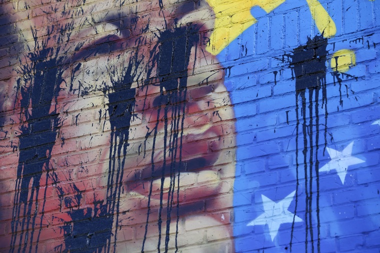 A mural featuring an image of former Venezuelan President Hugo Chavez was defaced in the Bronx borough of New York, Tuesday, May 9, 2017.