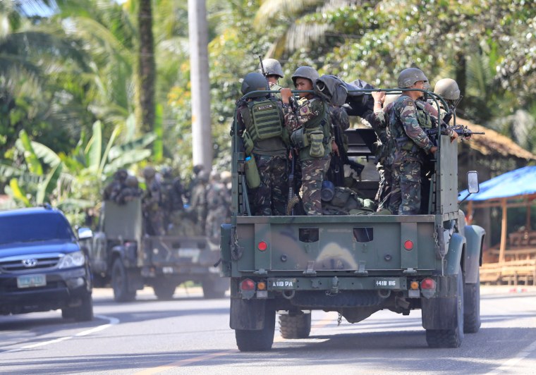 Image: Military vehicles carrying government troops head to Marawi City