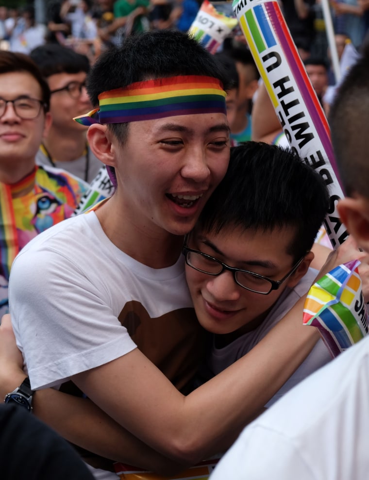 Image: Crowds cheered, hugged and wept as a Taiwan court ruled in favour of same-sex unions.