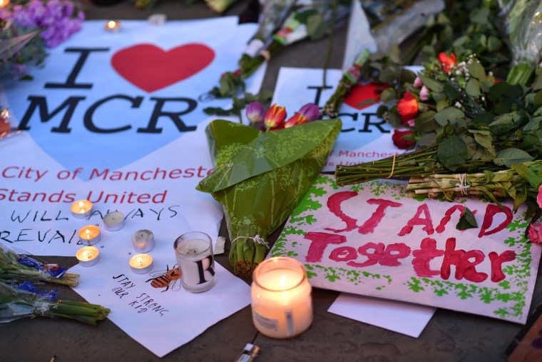 Image: Message and floral tributes in Manchester's Albert Square