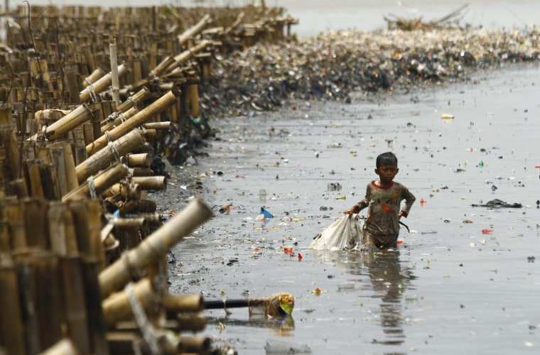 Children Collect Valuable Goods From The Garbage In Indonesia