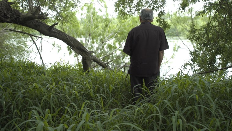 Noel Benavides looks out at the Rio Grande River from his property in Roma, Texas.